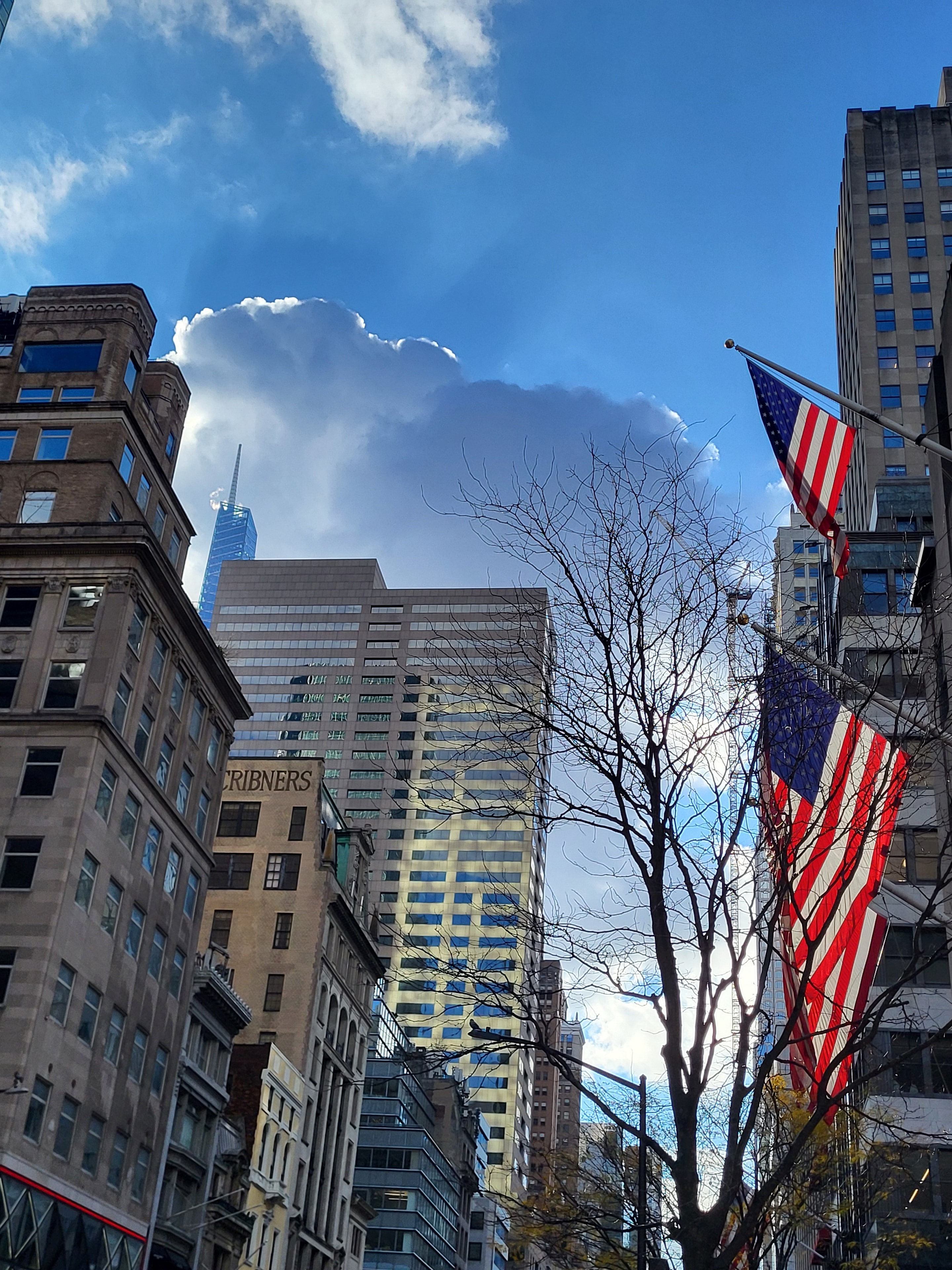 American flags flying over New York City buildings — Lest We Forget